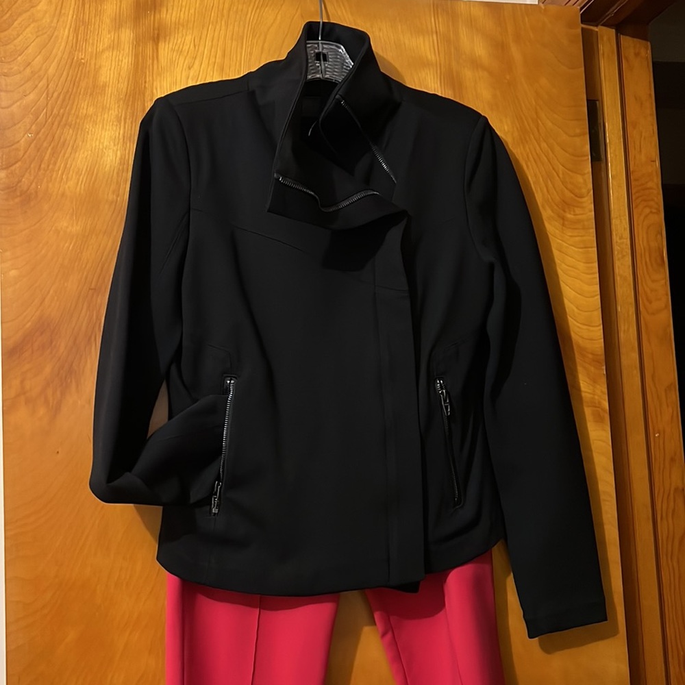 Black short jacket with side zipper fabric has some stretch and is form fitting